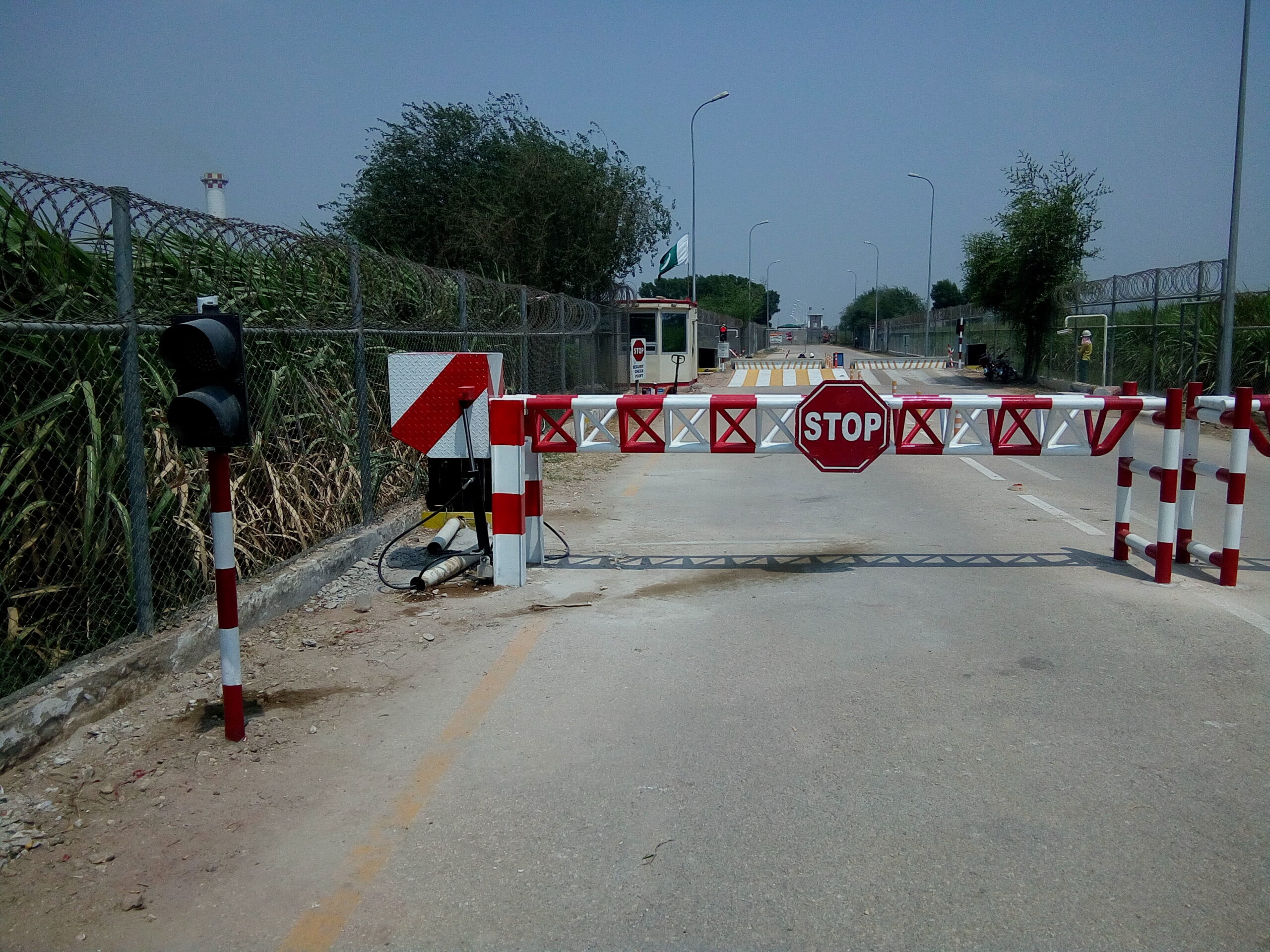 boom barriers intalled on double side of the road ouside a factory